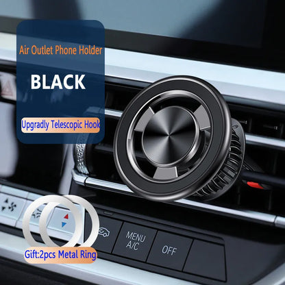 Silver magnetic phone holder clipped onto a car air vent, showing the bracket and separate magnetic metal plate.
