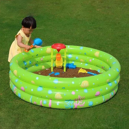 Kids playing in a colorful inflatable sea ball pool with water