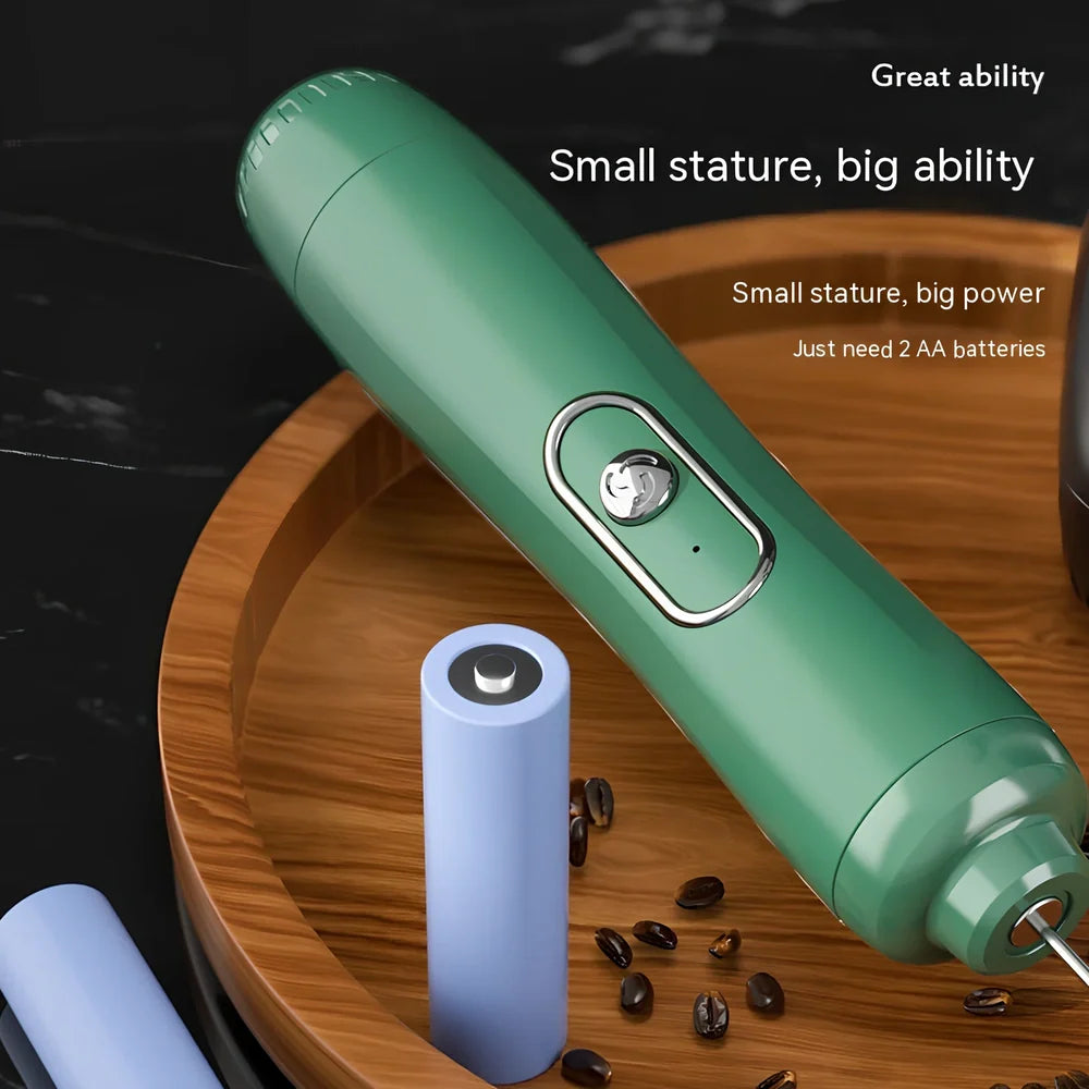 Battery-powered handheld milk frother in retro green, black, or white with stainless steel whisk