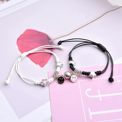 Magnetic suction couple bracelet pair in alloy with an electroplated finish, showing example designs like a crown and love lock.