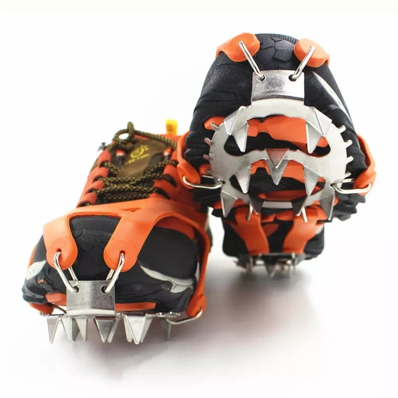 Reinforced large-tooth non-slip shoes in black and orange for superior traction on slippery surfaces