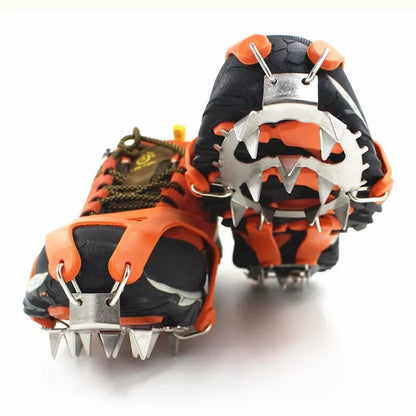 Reinforced large-tooth non-slip shoes in black and orange for superior traction on slippery surfaces