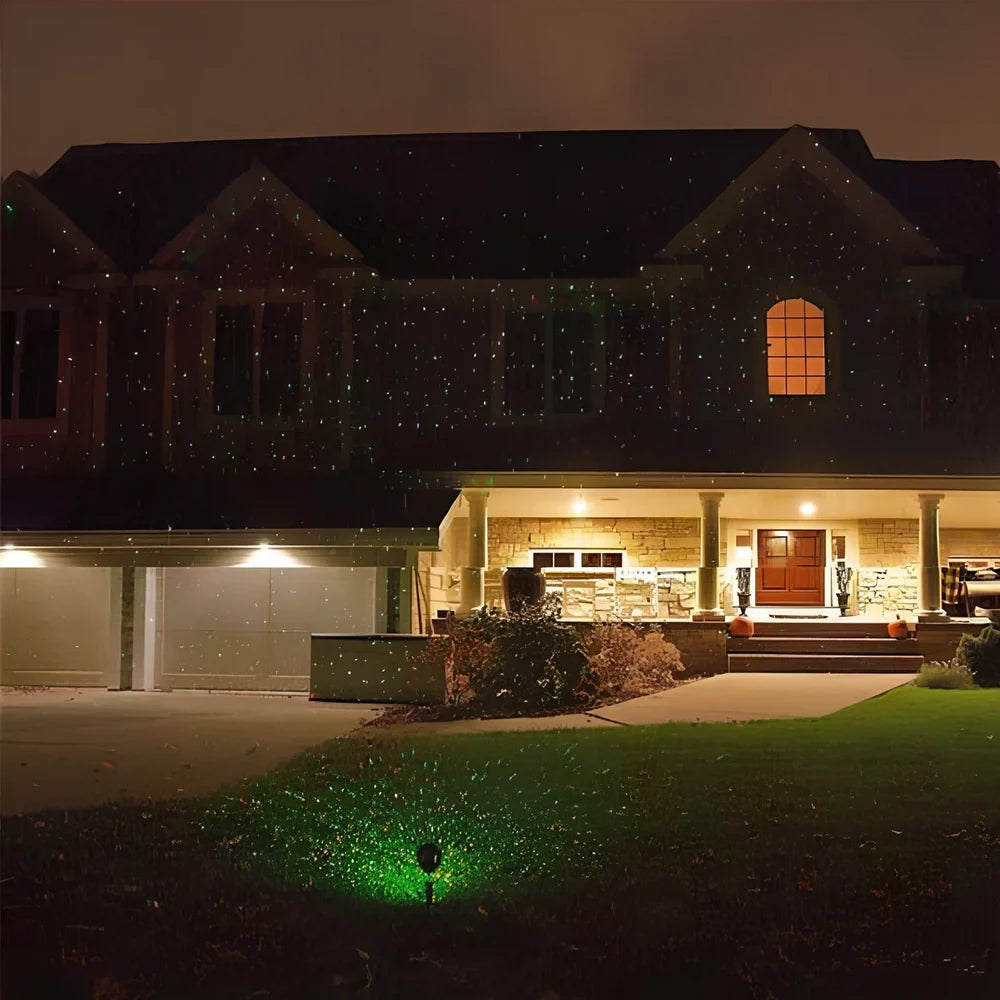 Black Christmas projection light with starry laser pattern on brick wall, 13.5cm unit with 29cm handle