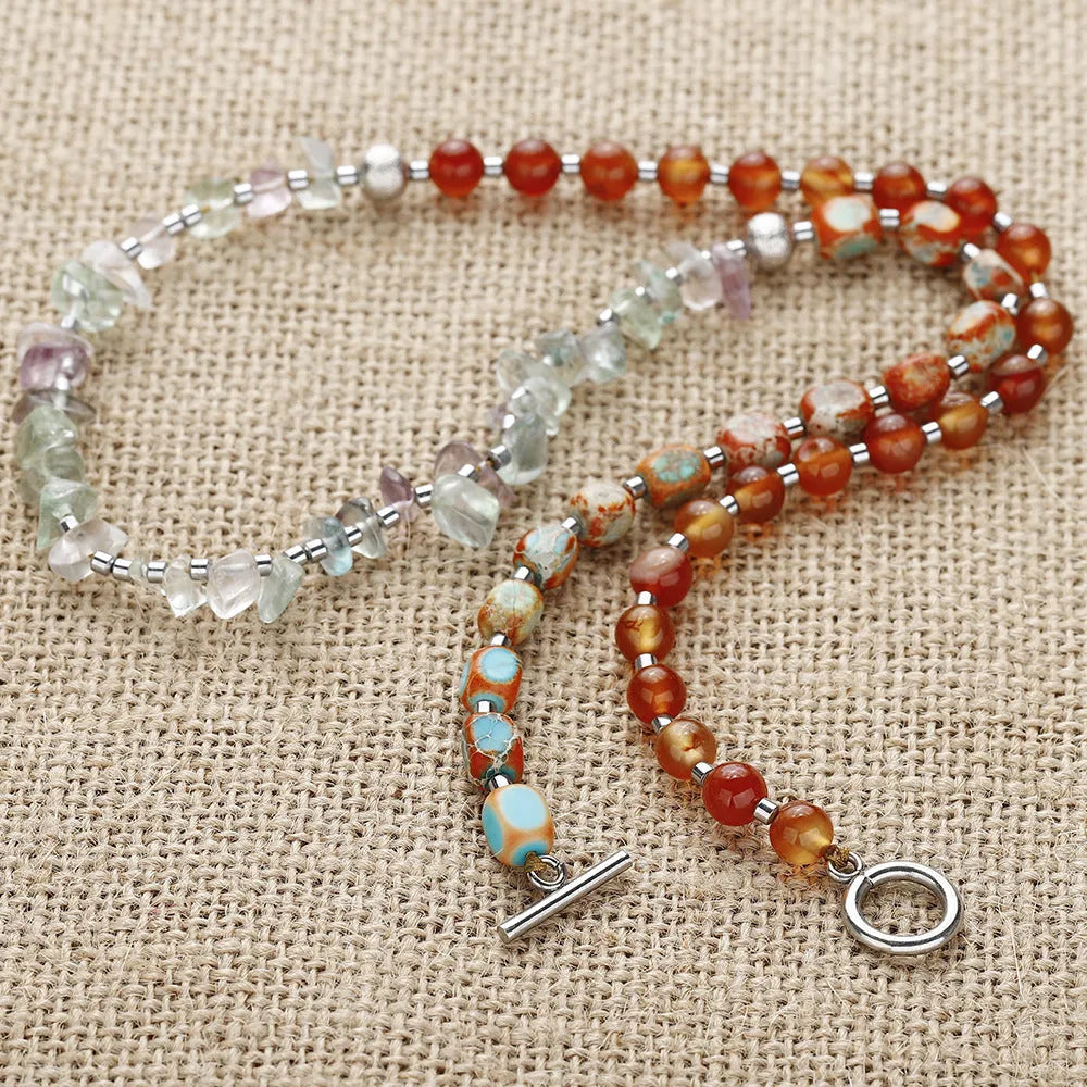 Hand-woven red agate round beads bracelet with geometric shapes and textured surfaces