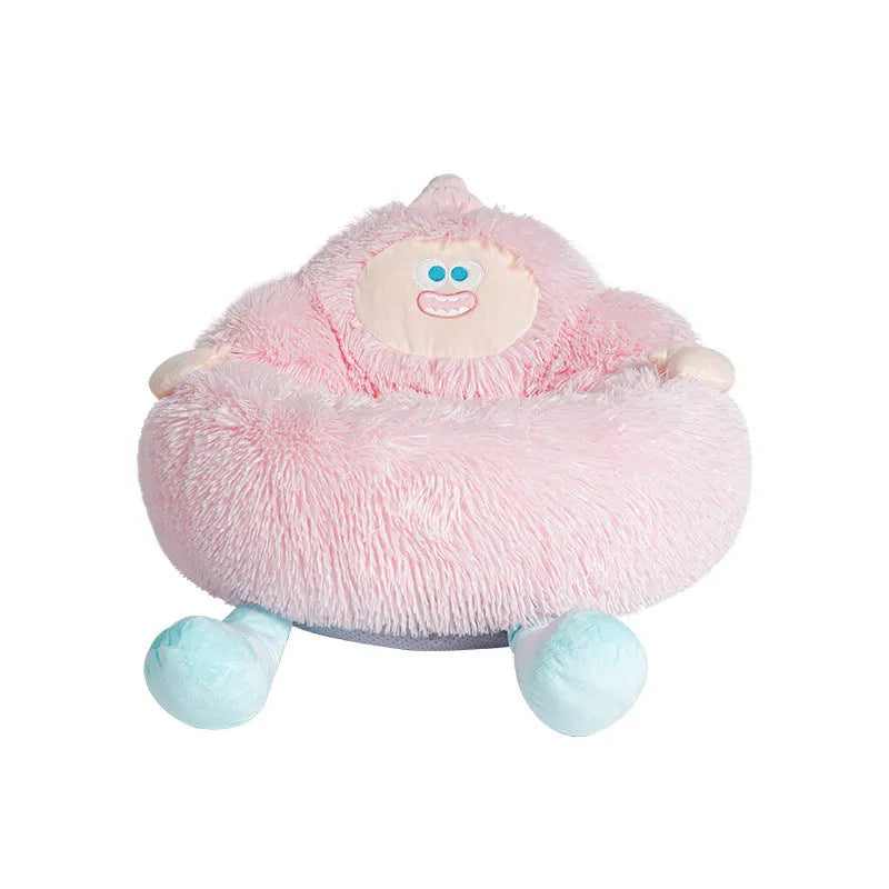 Grey plush donut-shaped pet nest bed with raised edges for a cat or dog.