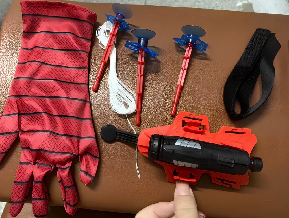 Green Spider Launcher wrist toy with transmitter and suction gloves on adjustable strap