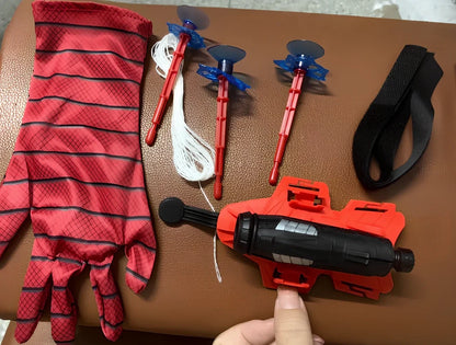 Green Spider Launcher wrist toy with transmitter and suction gloves on adjustable strap