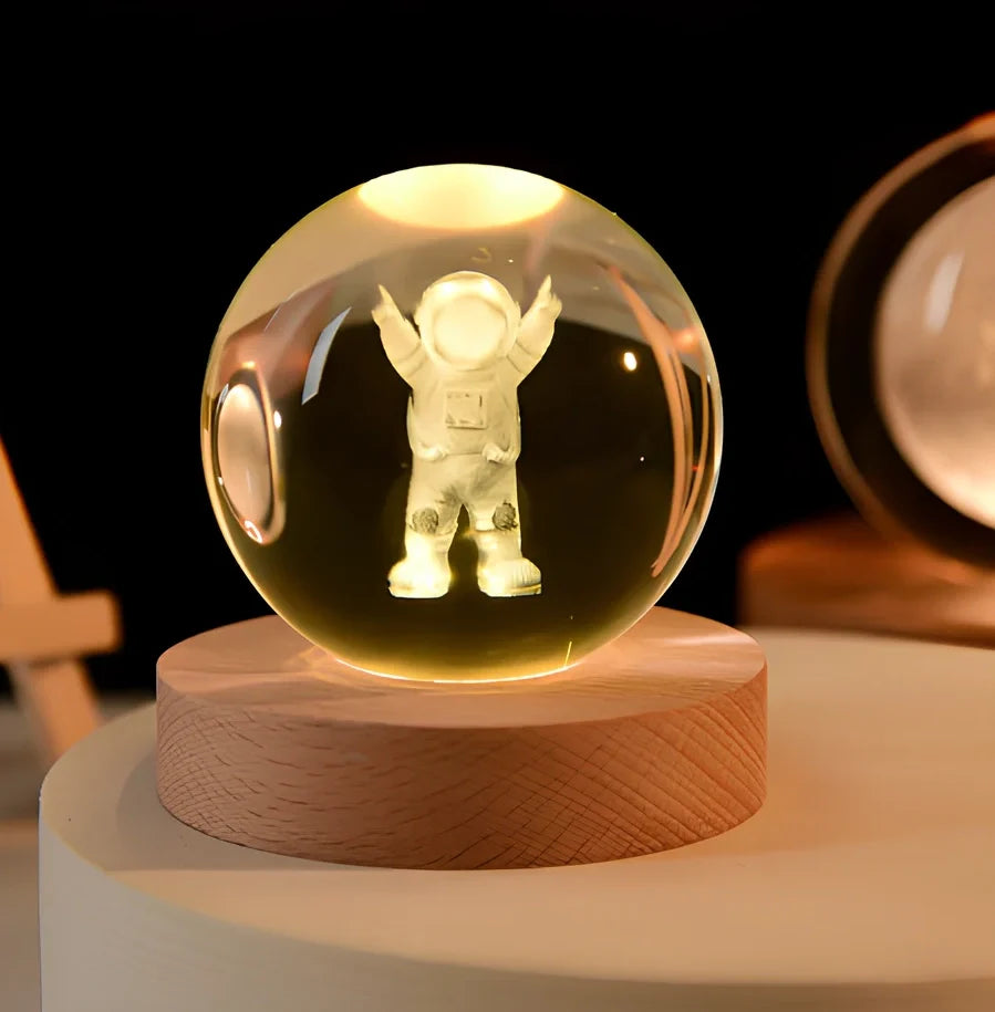 Transparent crystal ball with 3D laser inner carving of galaxy patterns on charging base