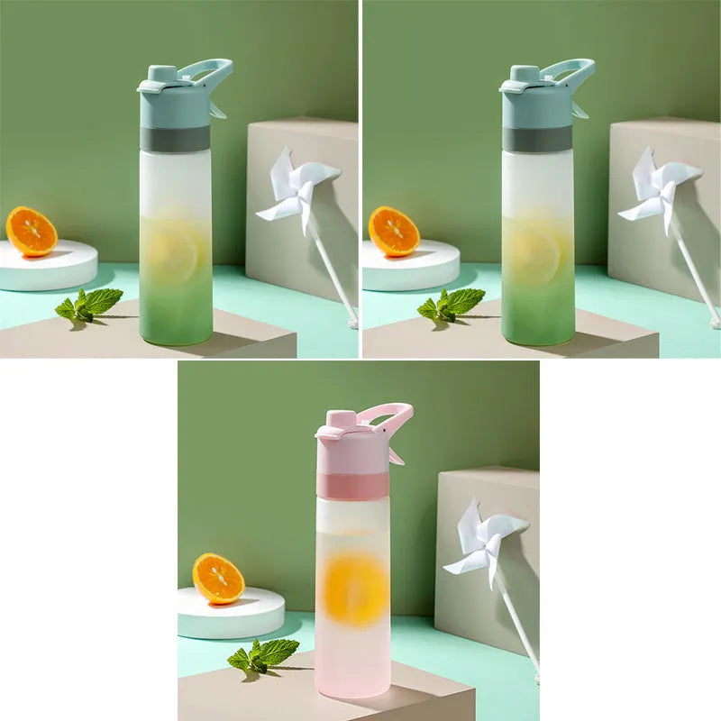 Large plastic spray water bottle with handle strap and leakproof lid in green colour.