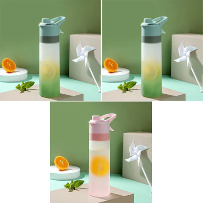 Large plastic spray water bottle with handle strap and leakproof lid in green colour.
