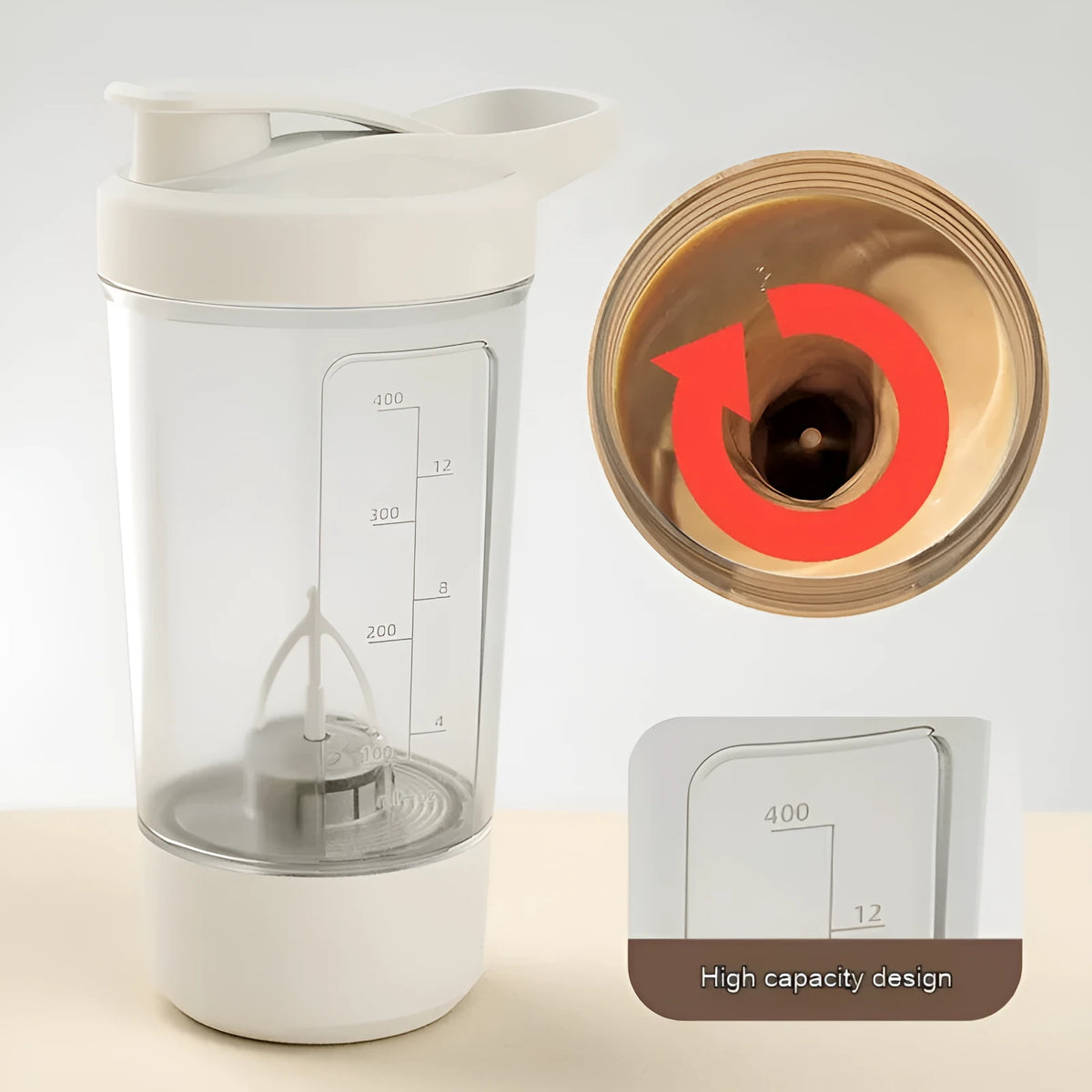 Black electric protein shaker bottle with lid and USB charging cable on a table