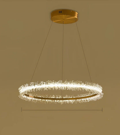 Gold electroplated crystal chandelier with remote control, adjustable height mechanism, and multiple LED lights