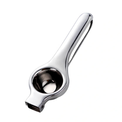 Manual stainless steel juicer with 5.5cm feed opening in gold finish on kitchen counter