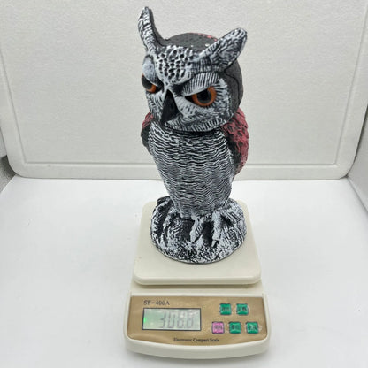 Set of artificial owl bait ornaments with shaking heads for scaring birds outdoors.