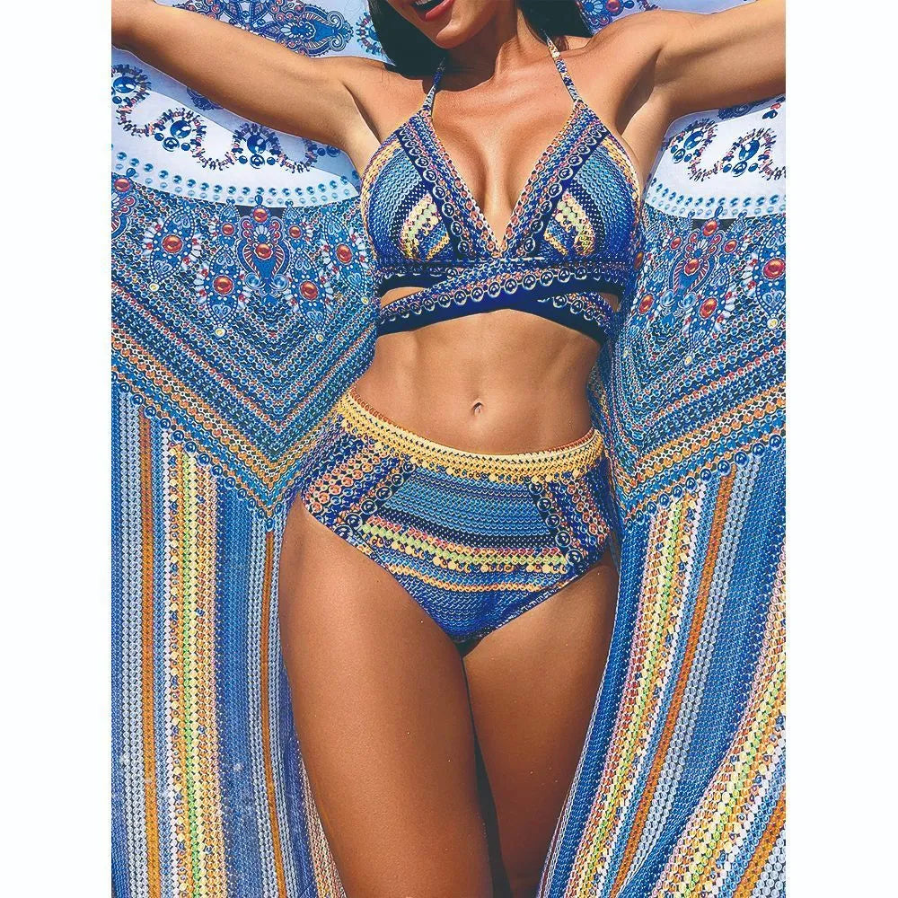 Blue cross-back bandeau top and high-waisted bikini briefs with a veiled split detail, laid flat.