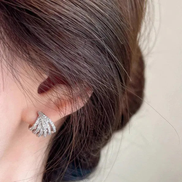 Geometric line design earrings with platinum electroplating on zircon, showing symmetrical patterns and clean architectural lines