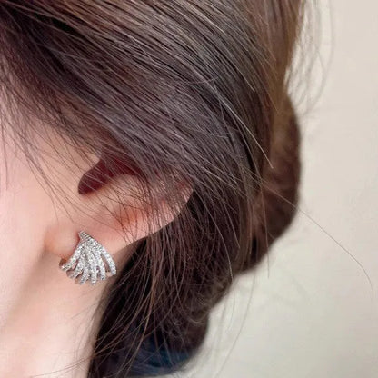 Geometric line design earrings with platinum electroplating on zircon, showing symmetrical patterns and clean architectural lines