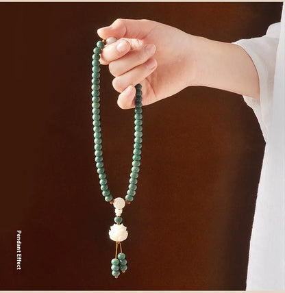 White jade bodhi and green sandalwood bracelet with a double ring safety buckle clasp.