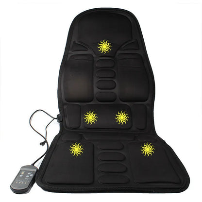Black heating massage mat with infrared function and a seat cushion on a floor