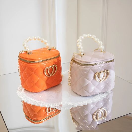 PVC bucket-style gel bag with a heart-shaped pattern, shown in apricot colour.