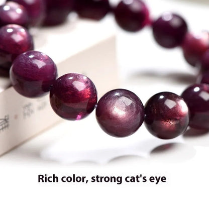 Purple lepidolite crystal bracelet with polished round beads in geometric design on wrist