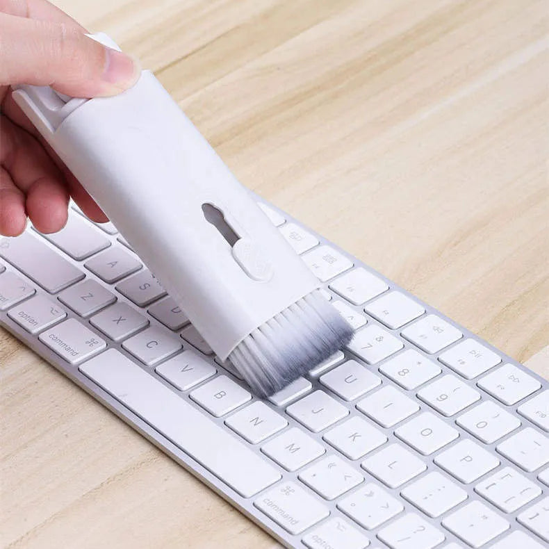 Multifunctional white cleaning pen kit open to show silicone tip, brush, keycap puller, and spray bottle for electronics.