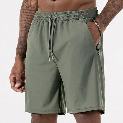 Men's black ice silk quick-drying sports shorts with drawstring waist on a mannequin.