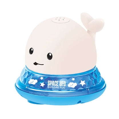 Automatic water-spraying whale bath toy with colourful lights floating in bath water.