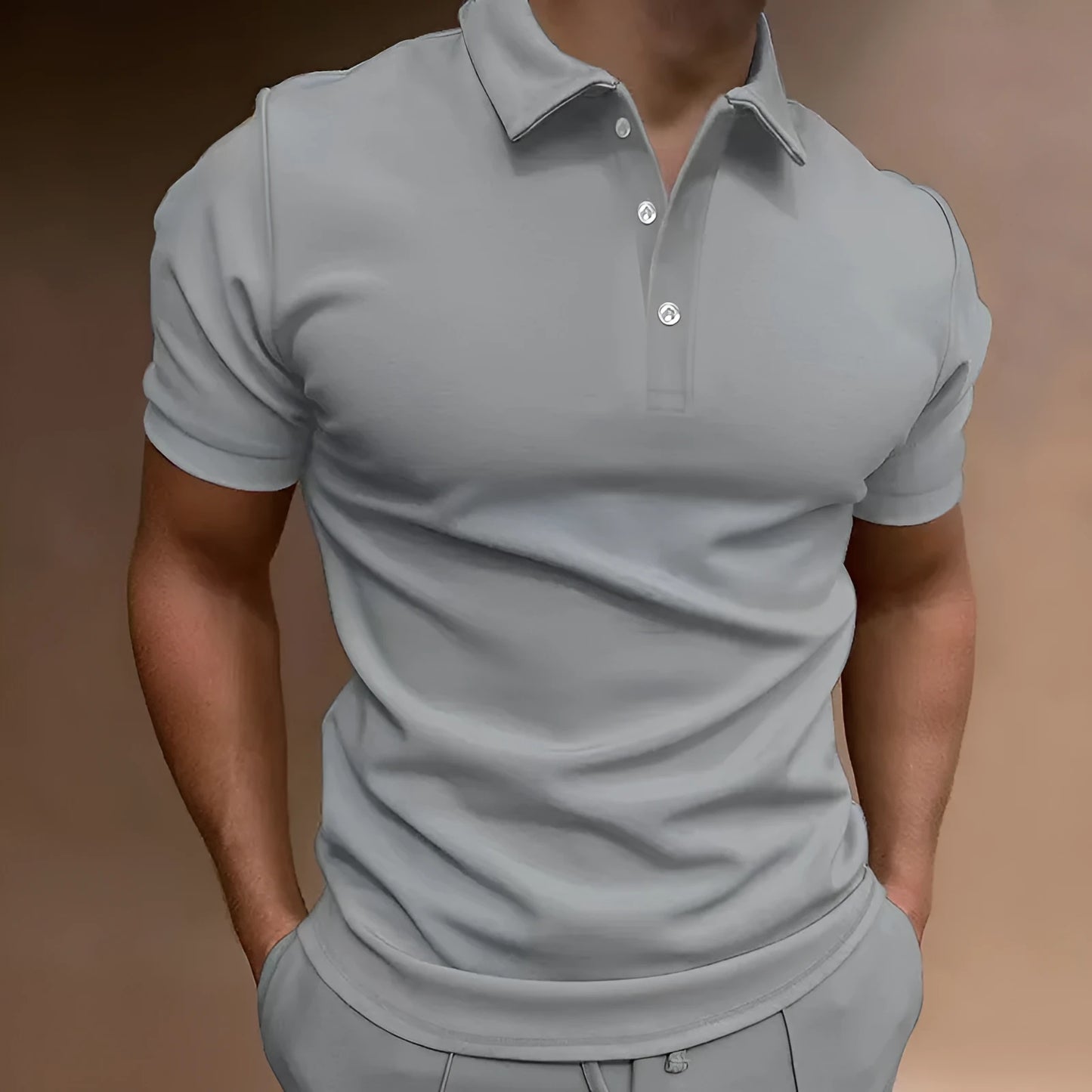 Men's grey loose-fit cotton blend t-shirt with a button detail and short sleeves.