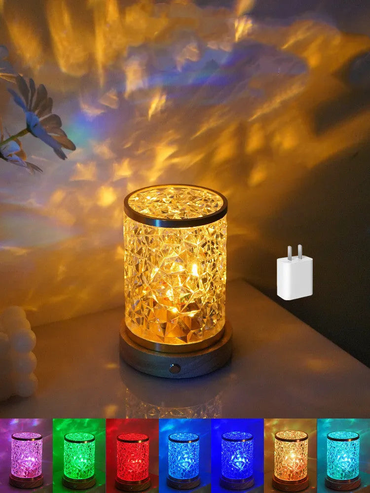 Rotating water ripple night light with acrylic construction and solid wood base measuring 9.5x14.5x10.5cm