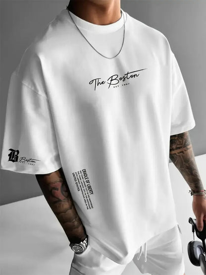 Men's round neck loose letter short sleeve T-shirt in polyester, shown in white, black, coral, and apricot