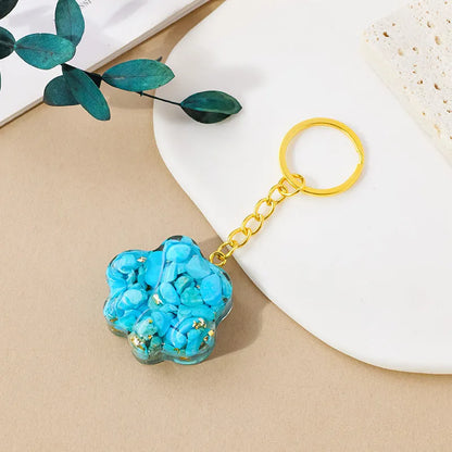 Natural crystal cat's paw keychain pendant showing gemstone options with integrated attachment loop