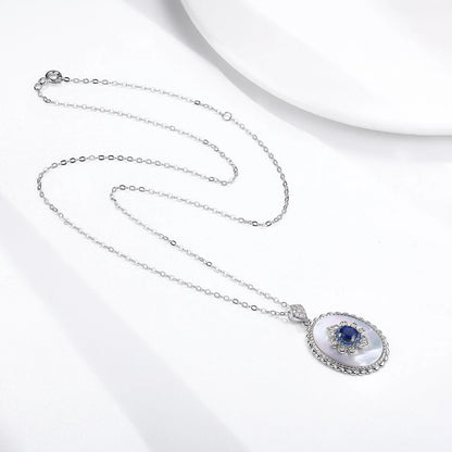 Elegant sapphire and diamond pendant necklace made of 925 sterling silver with a sleek geometric design and O-chain