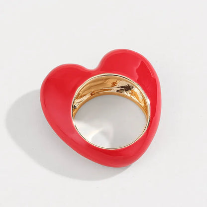 Heart-shaped enamel ring with three-dimensional detail in black, pink, purple, or red, sized for fingers 17-18