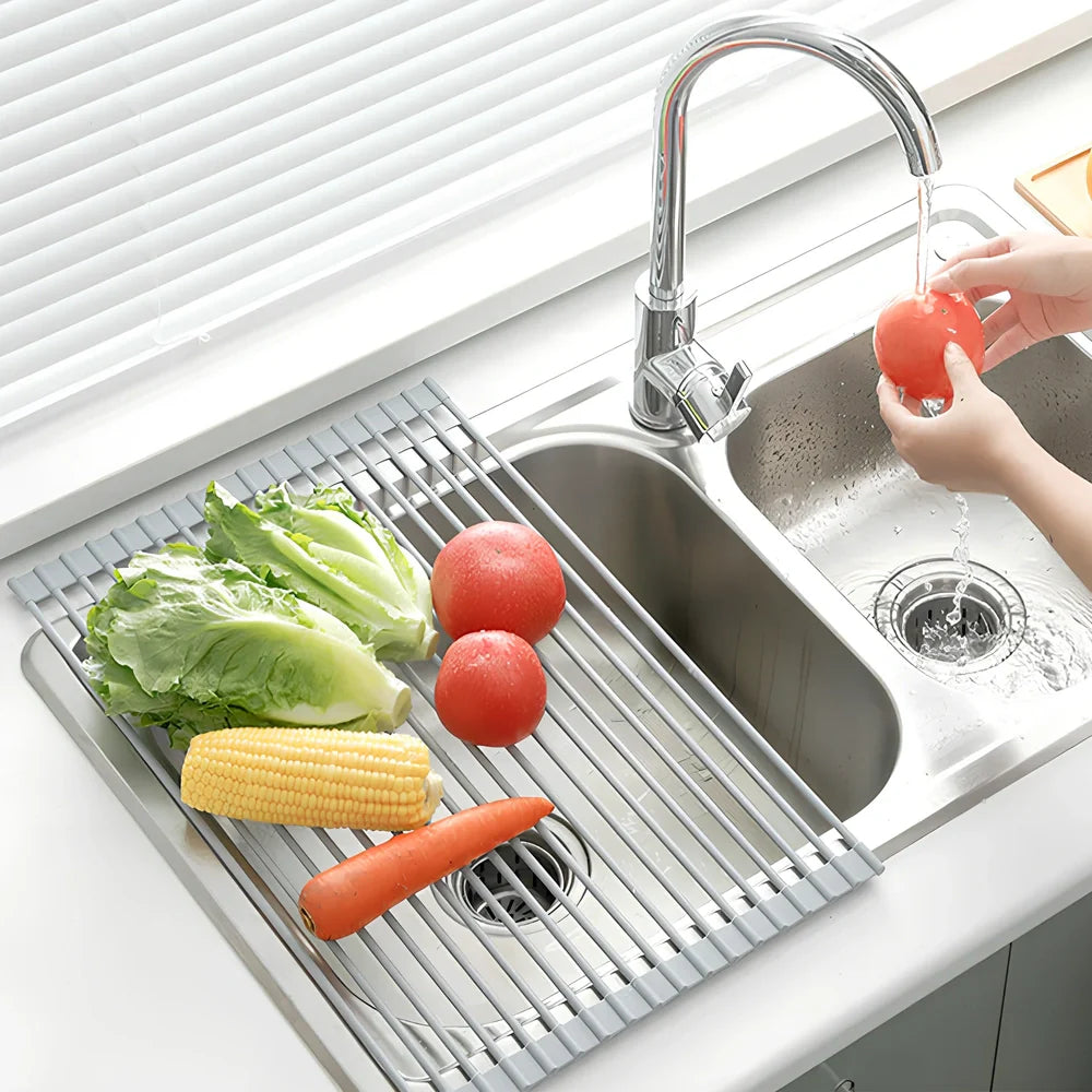 Black folding stainless steel sink drain rack with silicone edges, shown both unfolded for drying and folded for storage