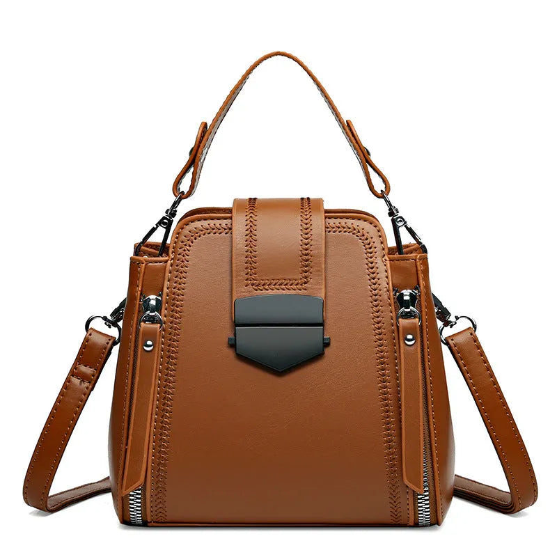 Soft PU leather ladies handbag with textured surface and sewing thread detailing in square vertical shape