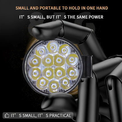 Small round white aluminium LED work light with IP67 rating for automotive use.