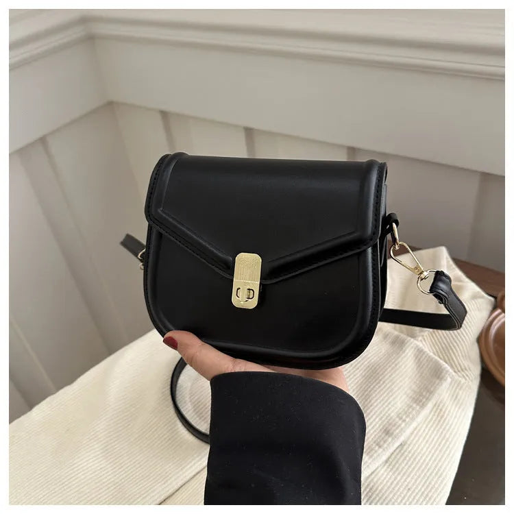 Soft PU leather messenger bag with clamshell opening in black, dark brown, khaki or white.