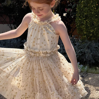 Apricot-coloured girls' halter neck tulle skirt with sleeveless design and floaty appearance
