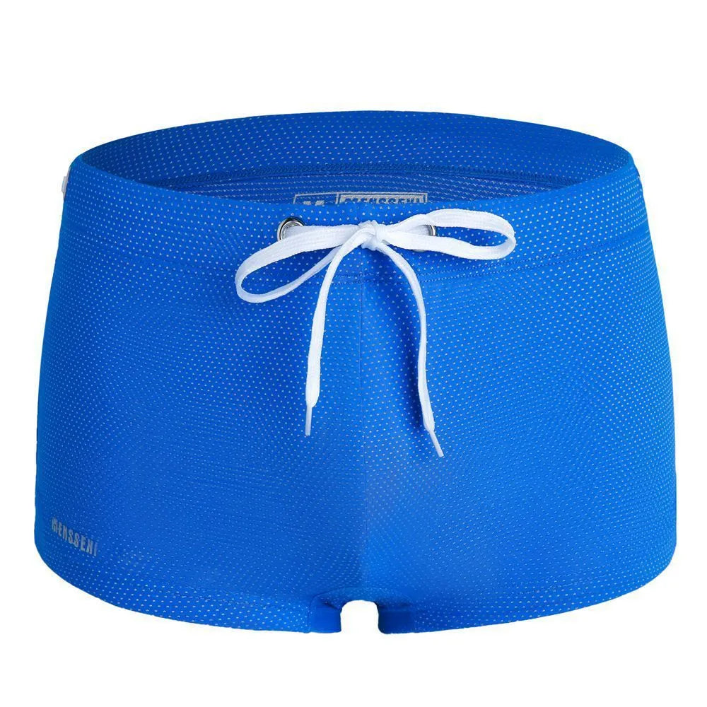 Men's low waist boxer style swimming trunks in nylon, available in multiple solid colours.