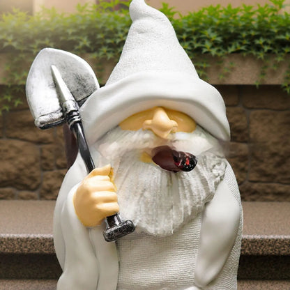 Resin Christmas garden ornament showing dwarf holding smoking shovel, 8cm height