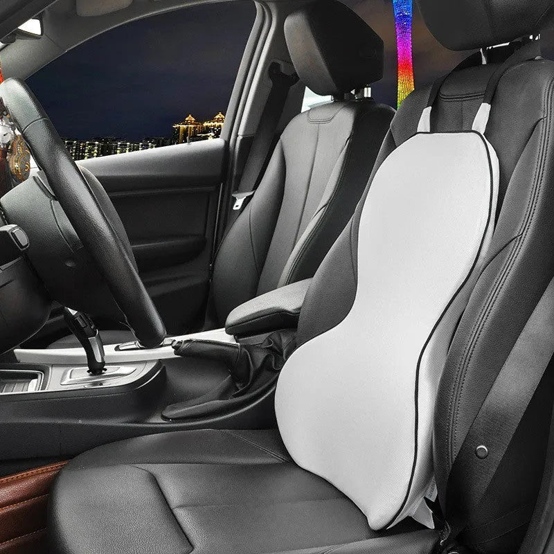 Memory cotton car lumbar support cushion in grey, showing its contoured shape on a car seat.