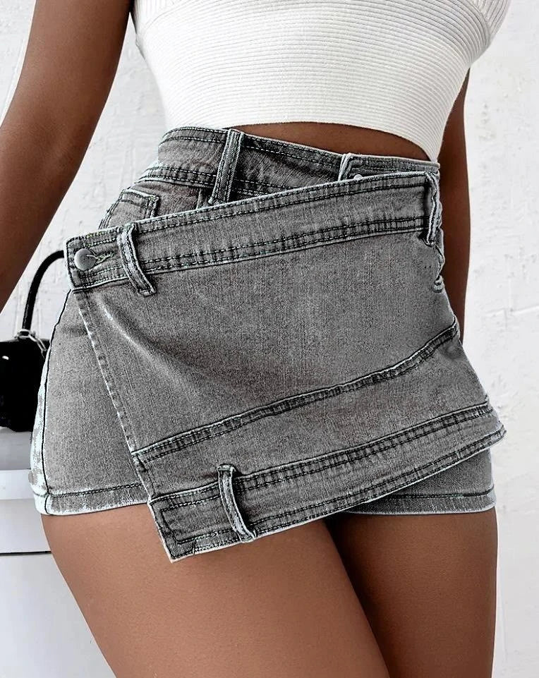Stylish Y2K-inspired denim shorts with an asymmetrical hemline, high-waist design, and stretch fabric for a flattering fit