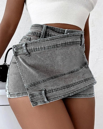 Stylish Y2K-inspired denim shorts with an asymmetrical hemline, high-waist design, and stretch fabric for a flattering fit