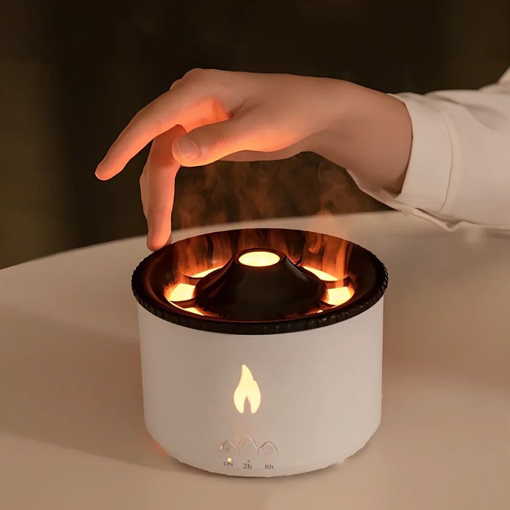 Black columnar ultrasonic humidifier producing jellyfish smoke rings with flame lighting effect