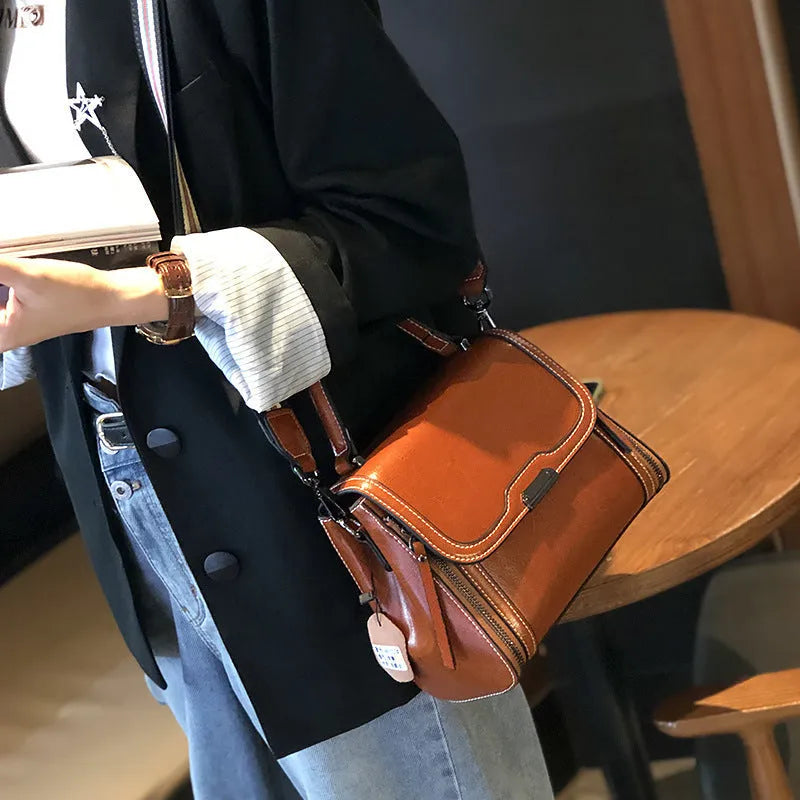 Women's genuine leather retro messenger bag in horizontal square shape with multiple internal compartments