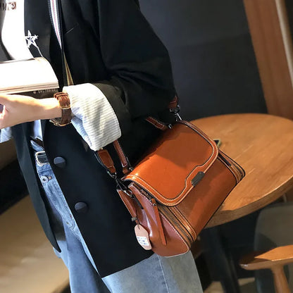 Women's genuine leather retro messenger bag in horizontal square shape with multiple internal compartments