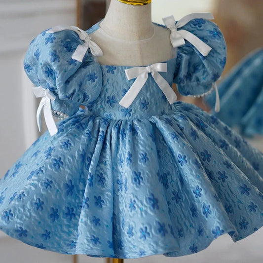 Blue polyester girls' princess dress with pettiskirt layering, shown in princess style for birthday occasions