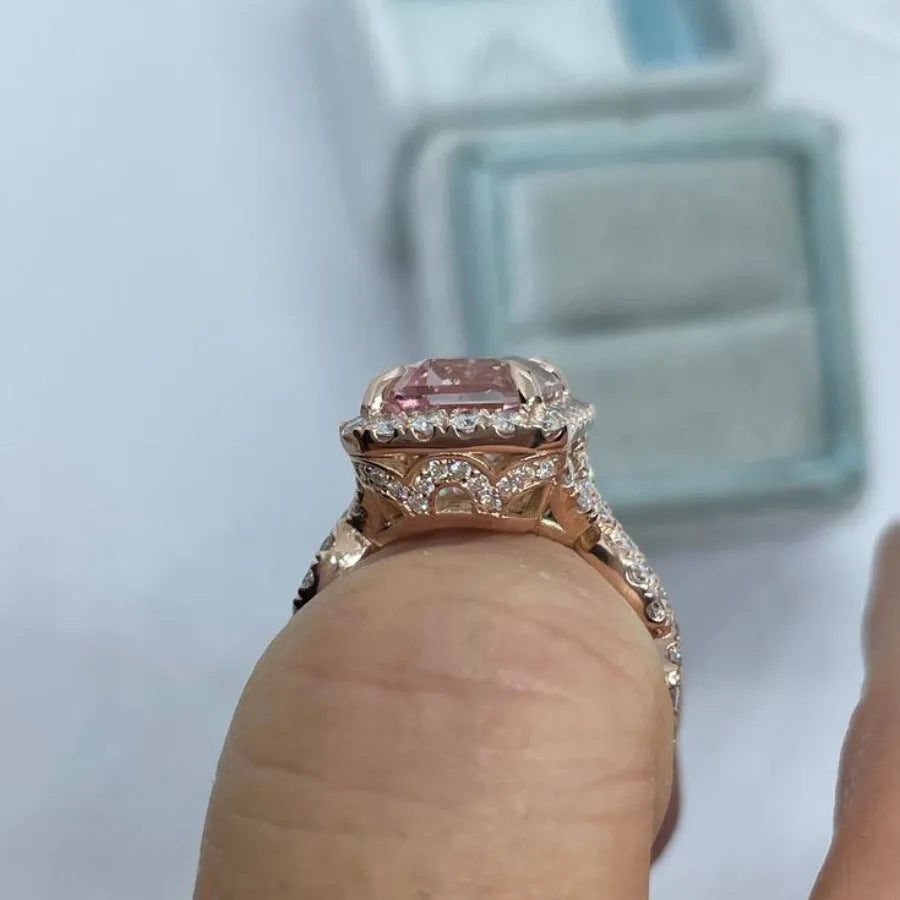 Rose gold electroplated geometric alloy ring on a white background.
