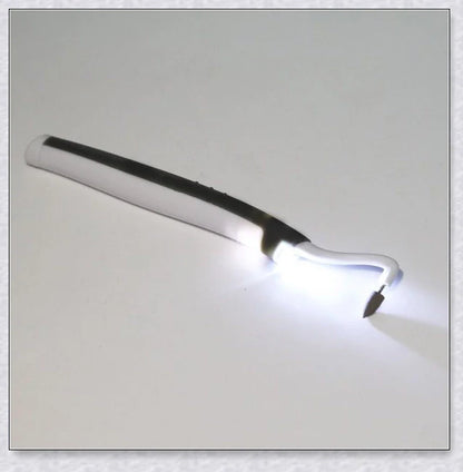 A white sonic tooth stain eraser and plaque remover with 3 different cleaning heads for removing stains and massaging gums.